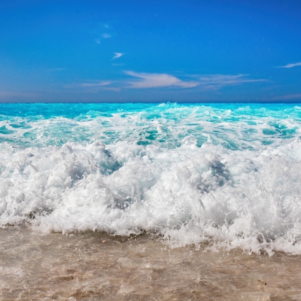 Waves crashing Ionian sea in Greece. Myrtos beach in Kefalonia