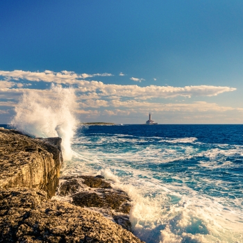 The waves crashing on the rocks in Kamenjak National Park in Premantura, Croatia